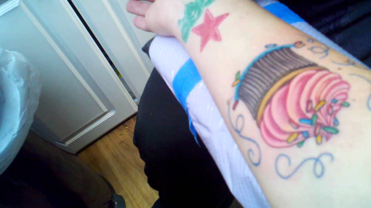 Finishing up my cupcake tattoo with Jimmies.