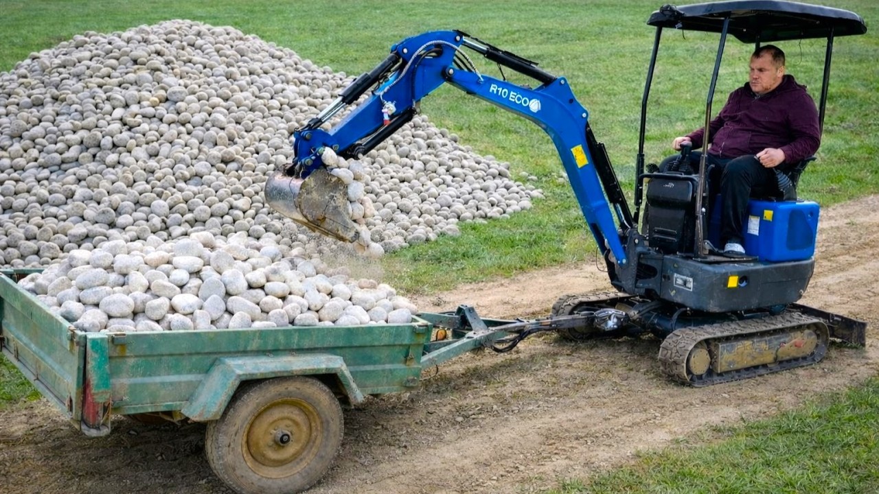 $1999 Chinese Excavator with Trailer drives STONES