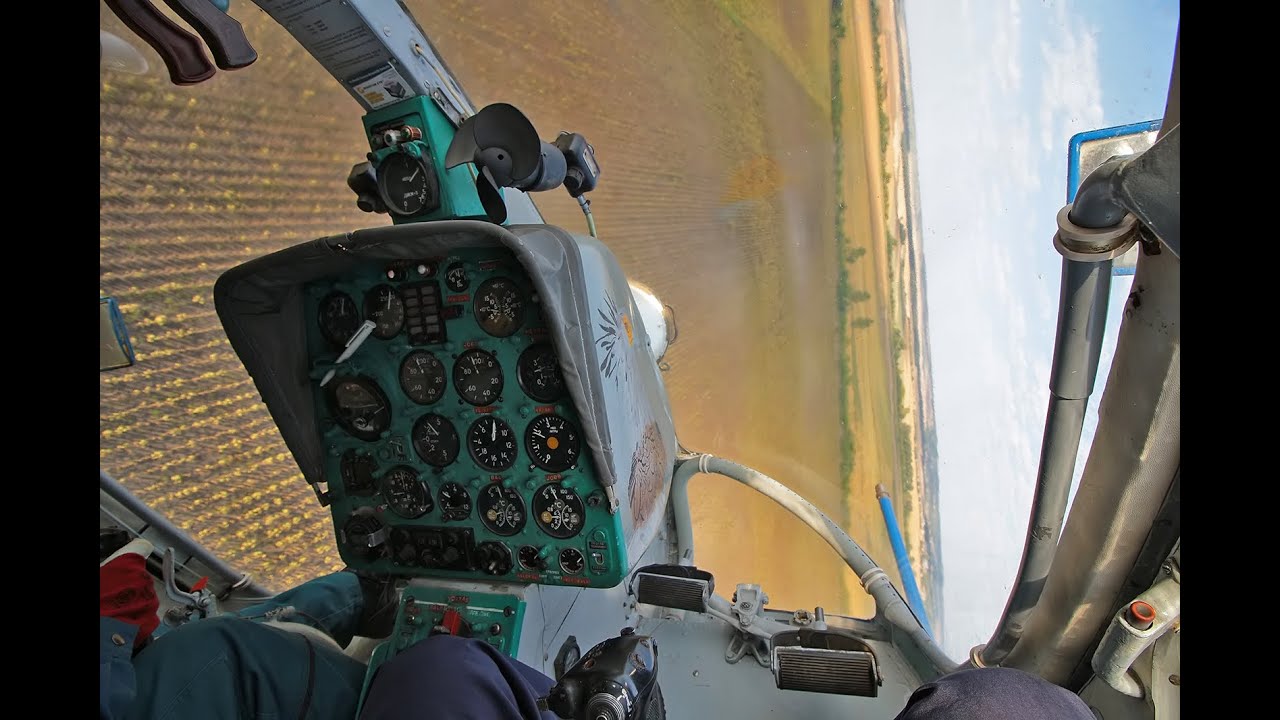 Kamov Ka-26 spraying sunflower near Cece, Hungary - cockpit view