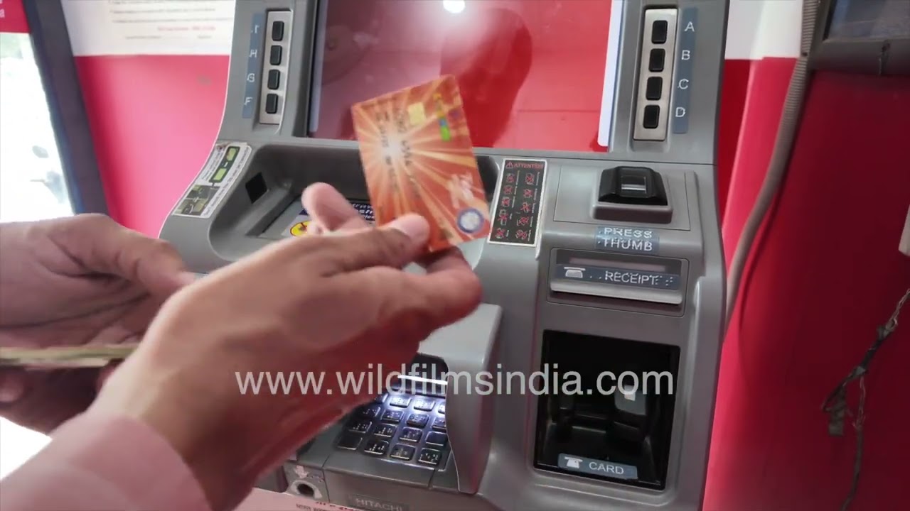 Customer withdraws cash from an ATM using a bank card and PIN