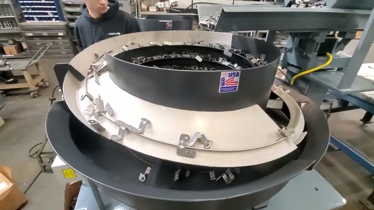 Left and right hand bracket Vibratory Feeders + escapements for robots Feeding Concepts Inc.