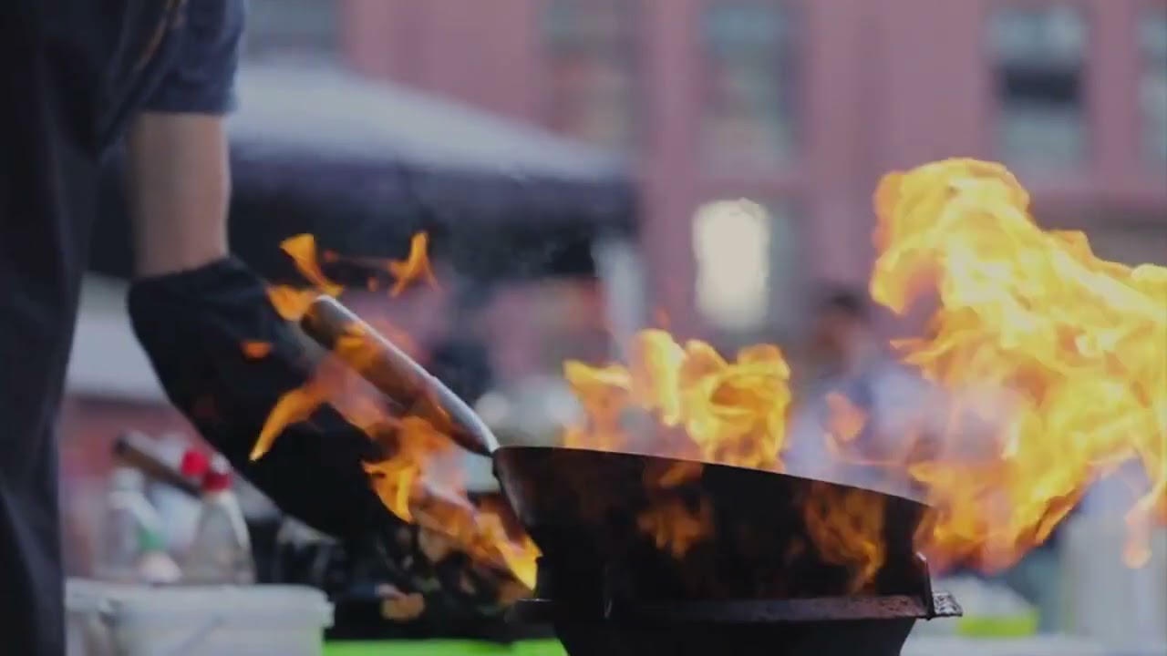 Street Food. Chef Cooking Thai Meal In Wok On Fire Outdoors