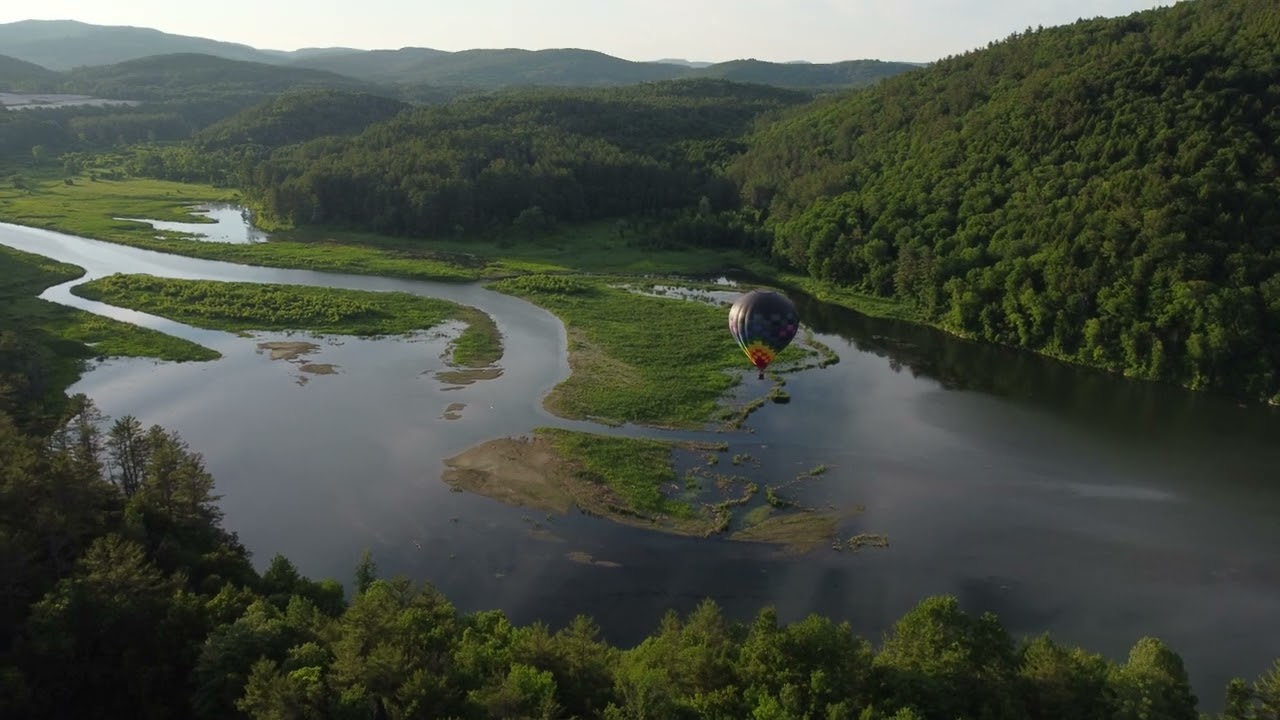 Hot air balloons over the Ottauquechee River