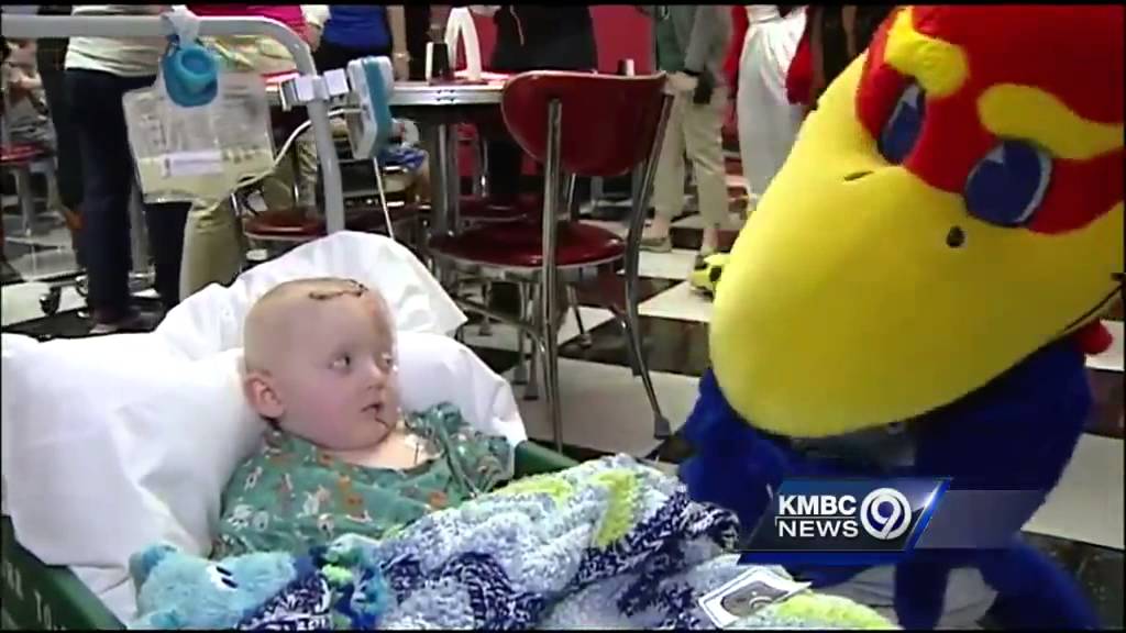 Mascots visit with young hospital patients