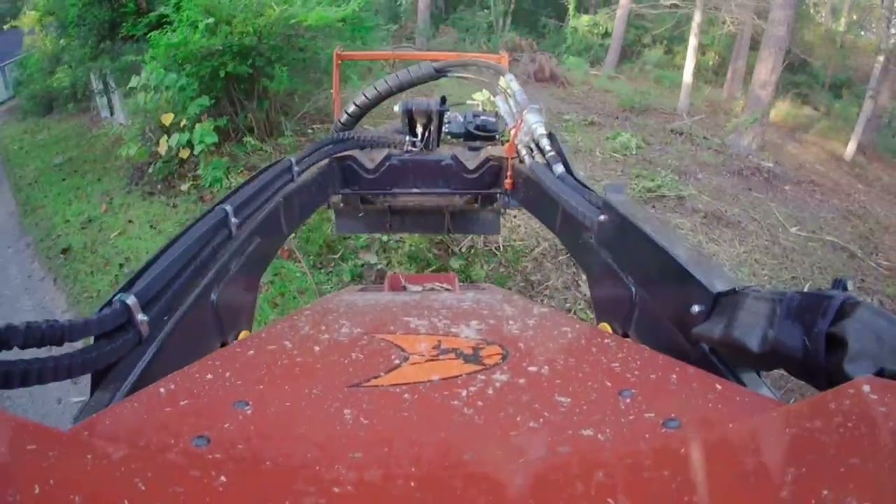 Mulching underbrush with Ditch Witch SK1750 and TMC Concela TLI-090