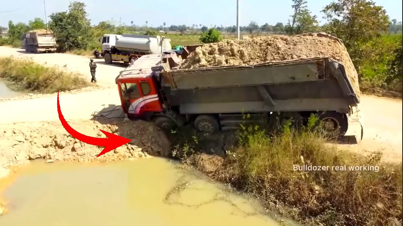 Incredible landfill! Mix Dump truck 25ton Drive Back Uploading Landslide Overturned into Canal Water