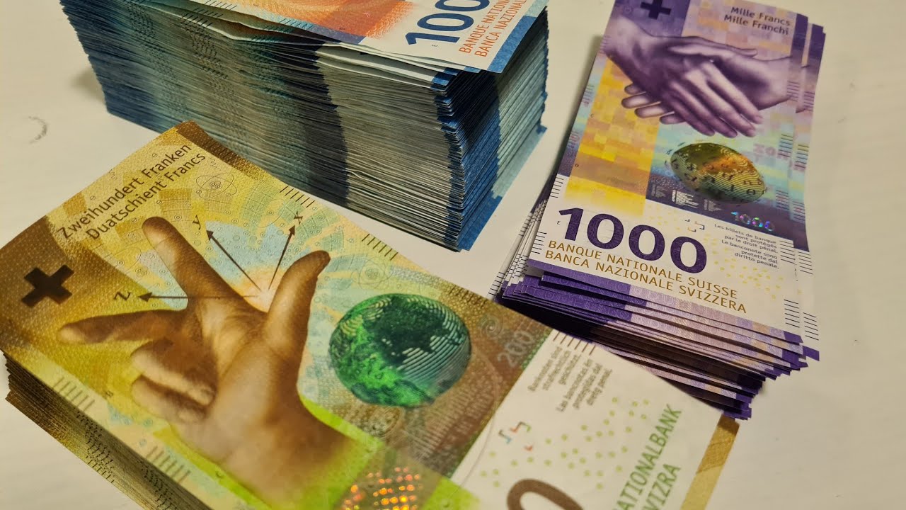 Counting 100000 CHF.  Swiss money