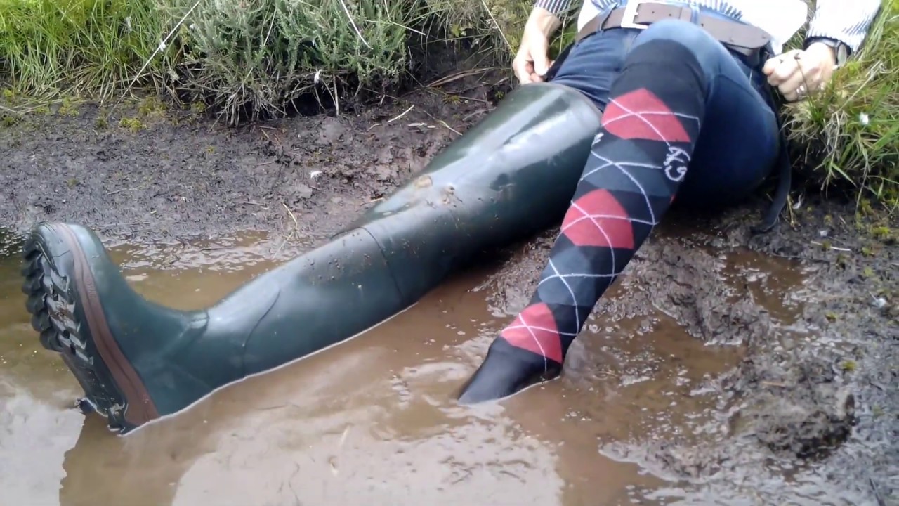 Video 34 - Blondes have moor fun - Taster (jeans and rubber thigh waders, wet and muddy in a pond)