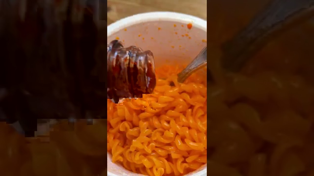 I made microwavable mac & cheese with hot cheetos and hot sauce