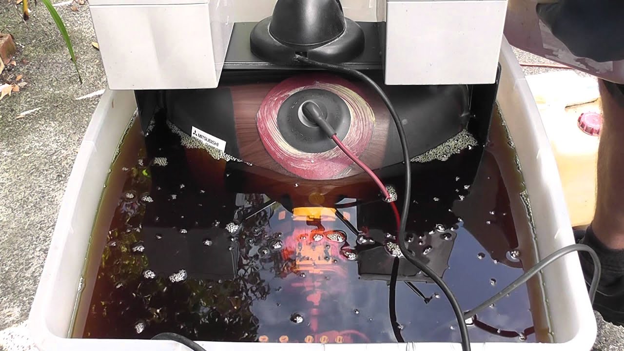 TV submerged under oil and then water