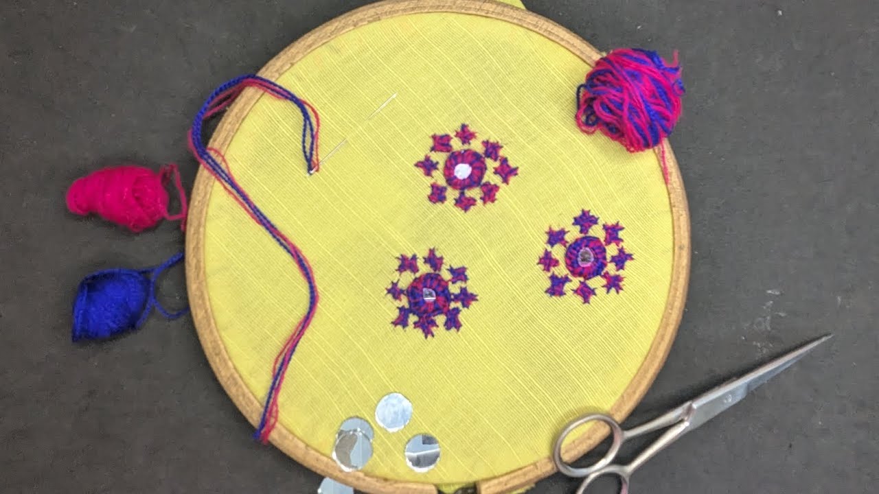 Flower embroidery and mirror work on cloth 