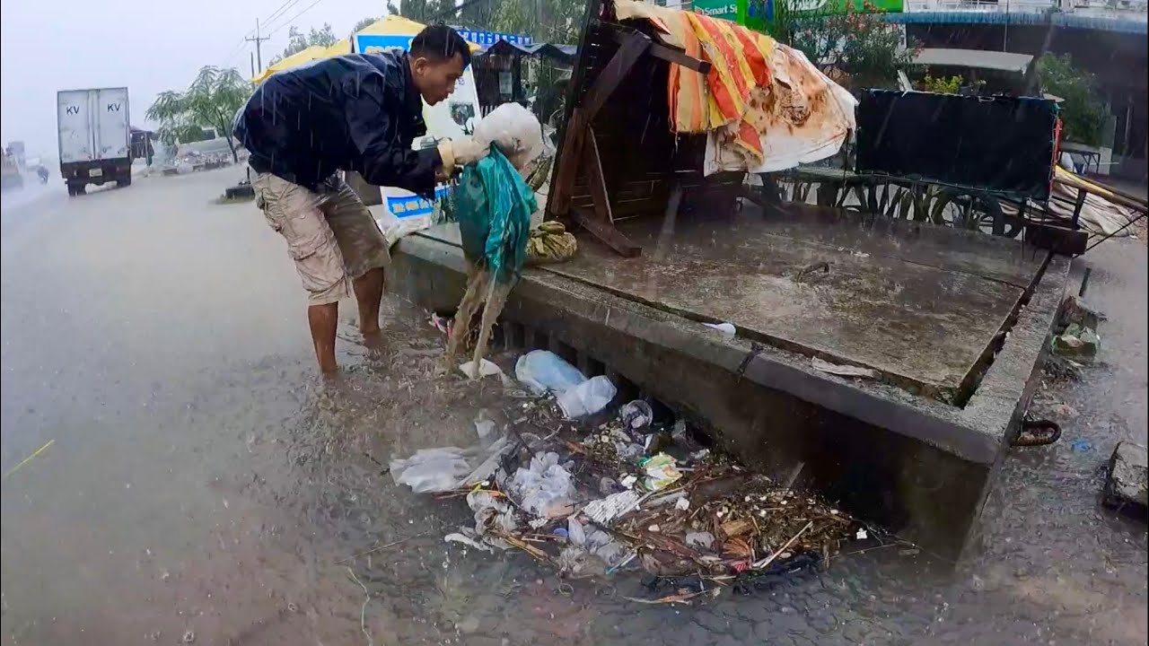Hard Work with Prevent Unclog  Culvert Drain by Plastic Dirty Under Rain Storm Flooding