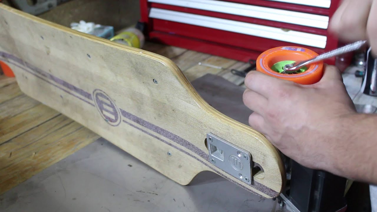 Evolve electric skateboard maintenance - changing bearings and rotating wheels