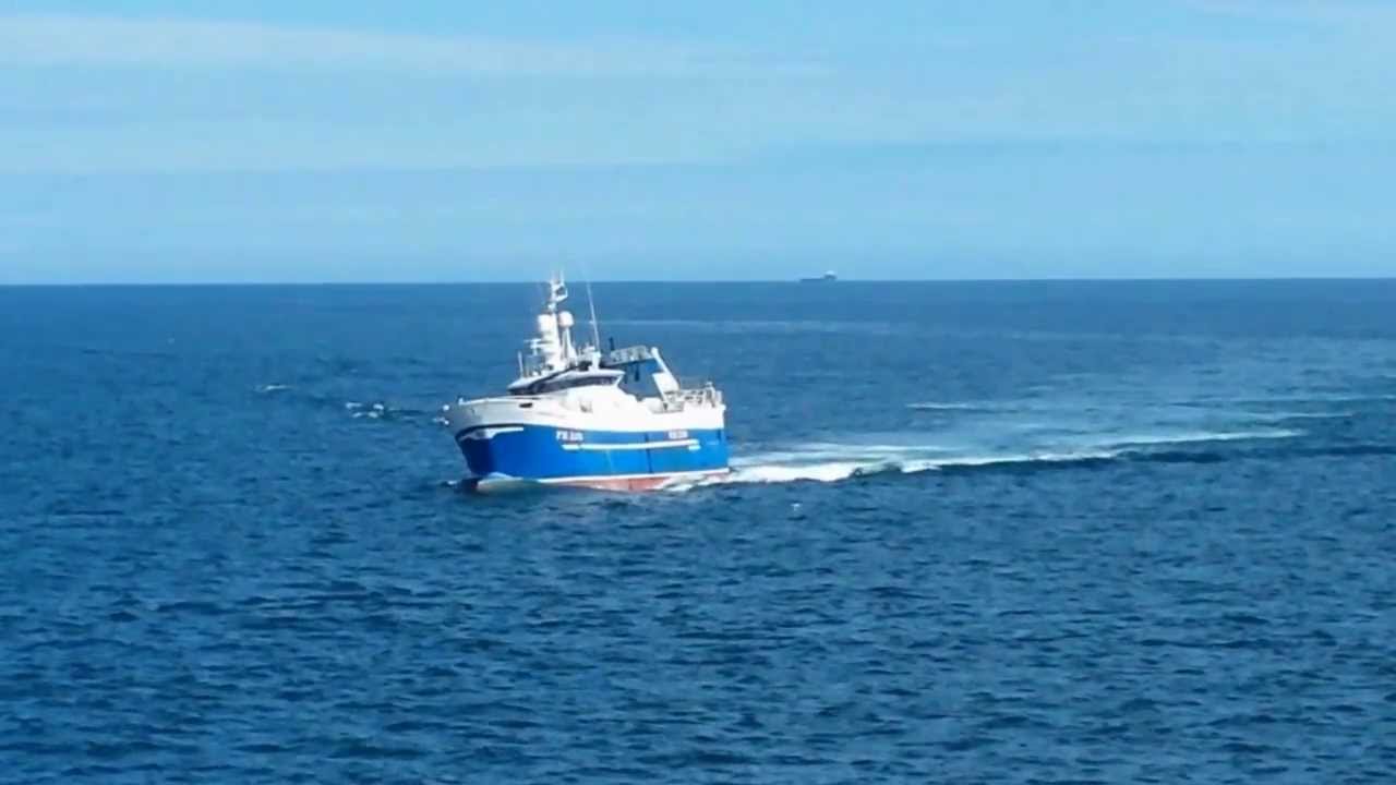 Rolling fishing vessel approaching Peterhead Harbour