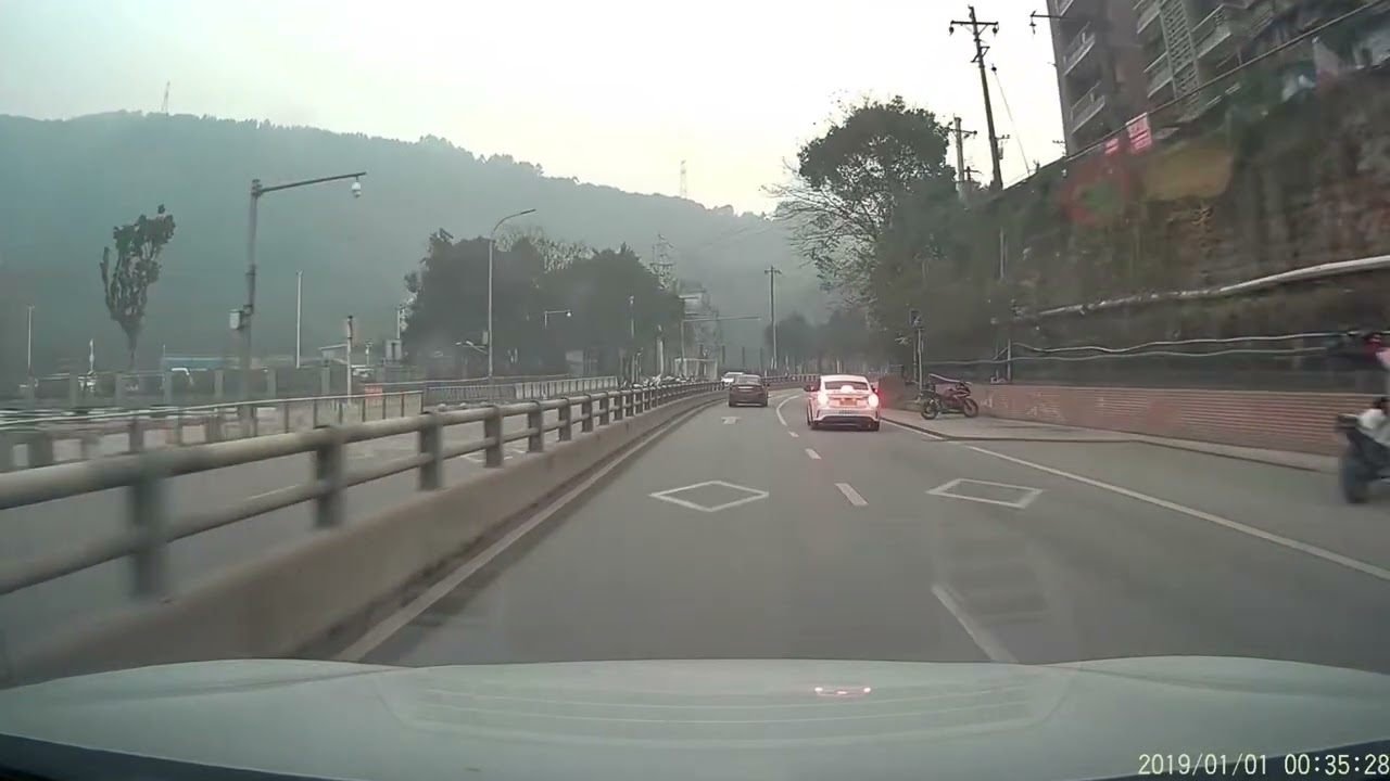 Car overturns near road barrier causing blockage in Chongqing, China