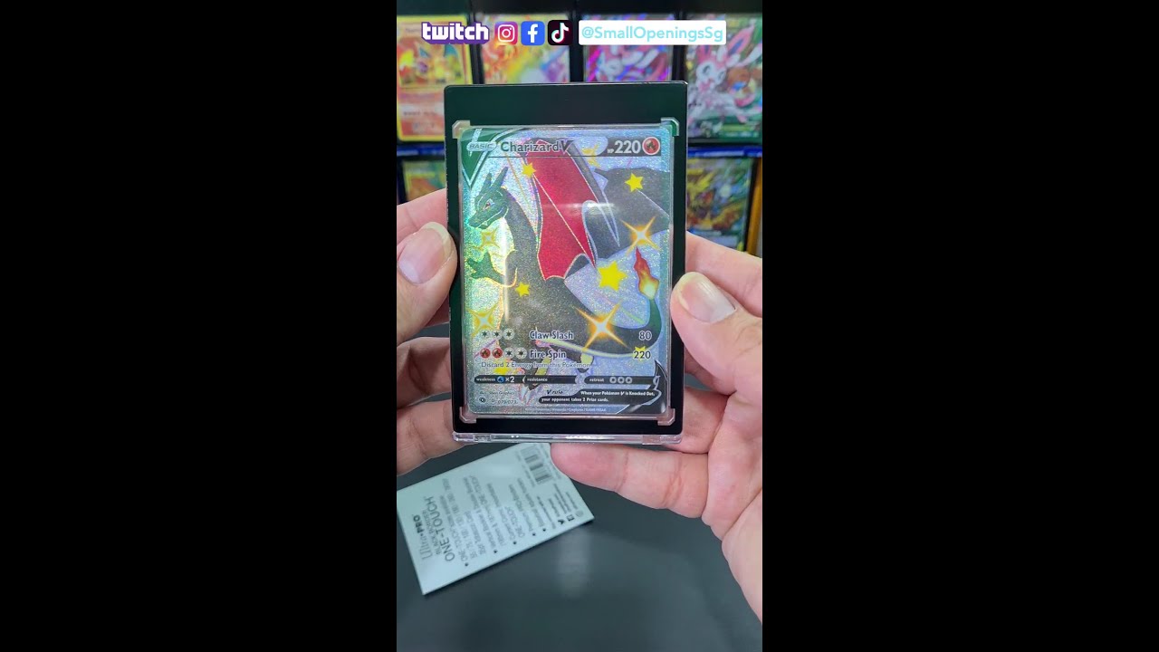 Putting Shiny Charizard V into Ultra Pro card holder!