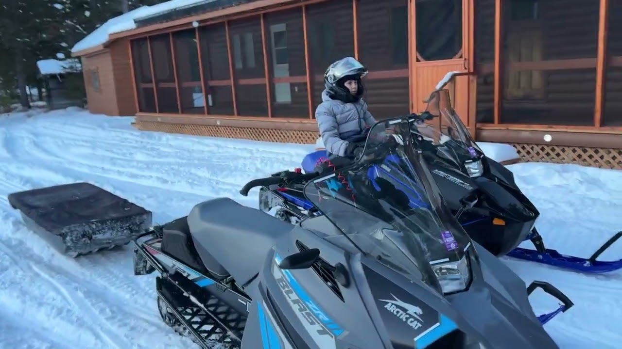 Sledding to famous remote salmon lodge #Atlanticsalmon #snowmobileadventure #logcabin