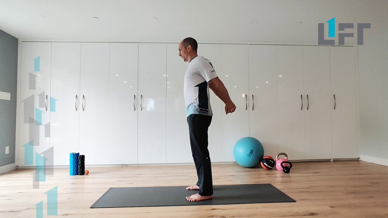 Clasped hands behind back arm extension stretch in standing - great for biceps, chest and shoulders!