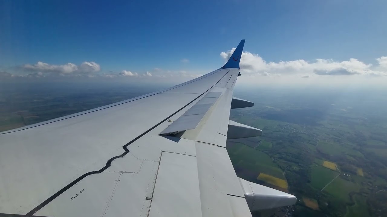 TUI Boeing 737Max8 wingview landing at Liege-Bierset Airport runway 4R {EBLG/LGG}