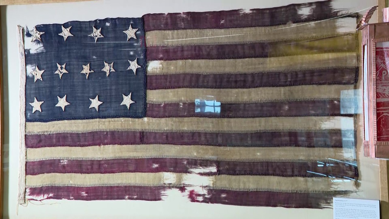Revolutionary War-era flag with 13 stars displayed in Massachusetts