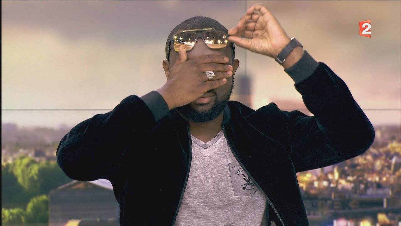 MAITRE GIMS ( enlève ses lunettes  ) : INTERVIEW 