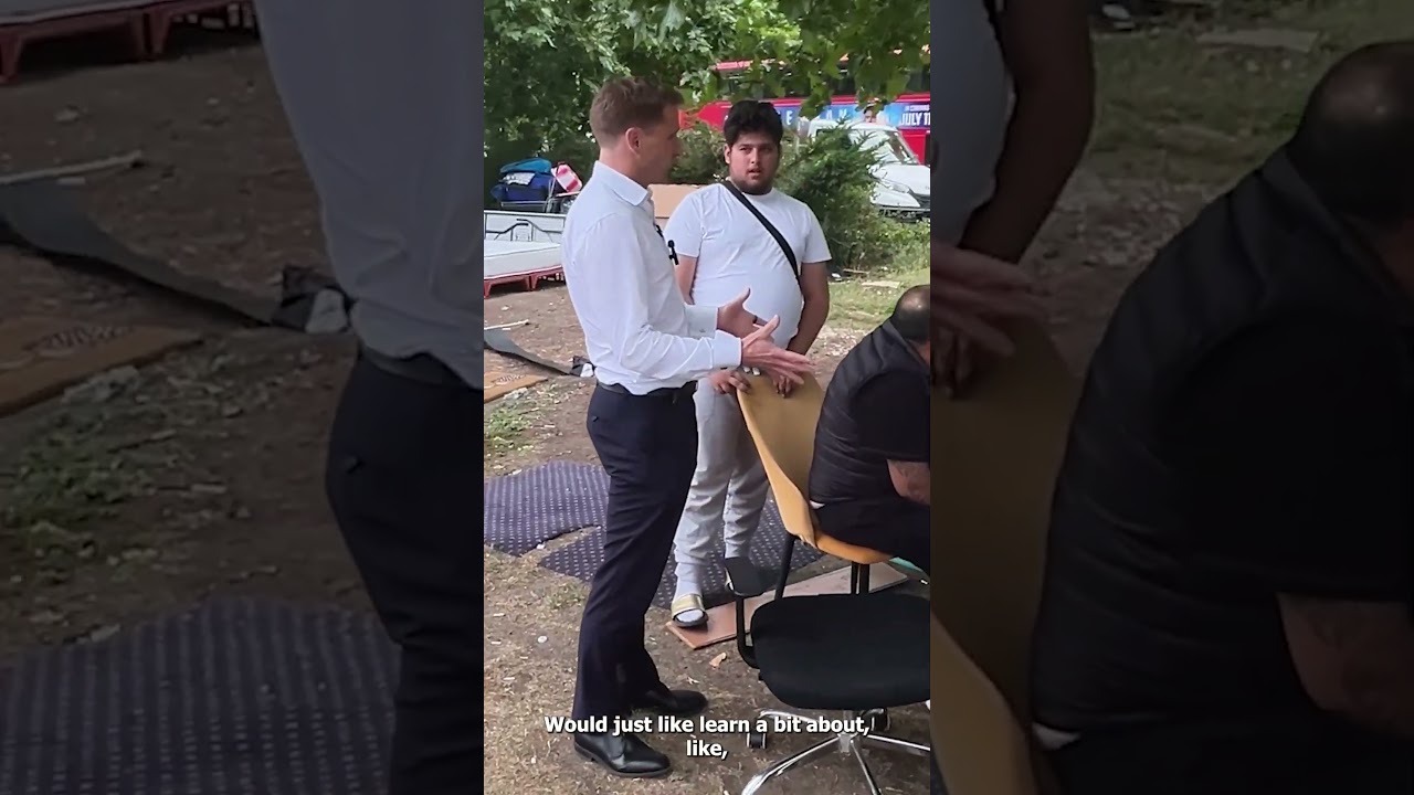 Moment furious migrants CLASH with Tory MP on posh London street