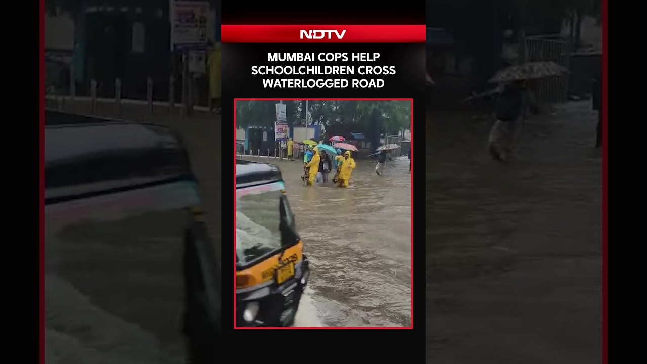 Mumbai Cops Help Schoolchildren Cross Waterlogged Road Amid Heavy Rains