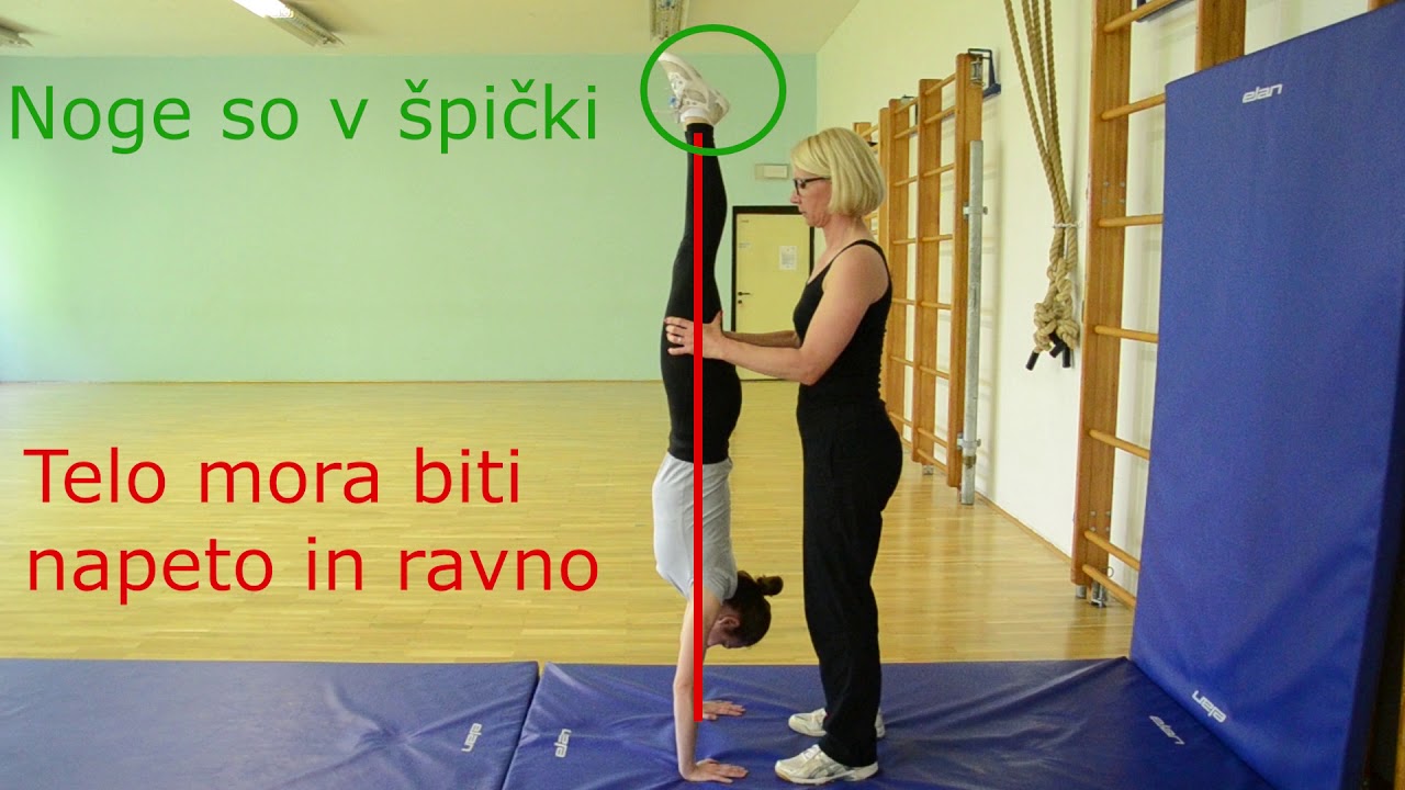 stoja na rokah z asistenco