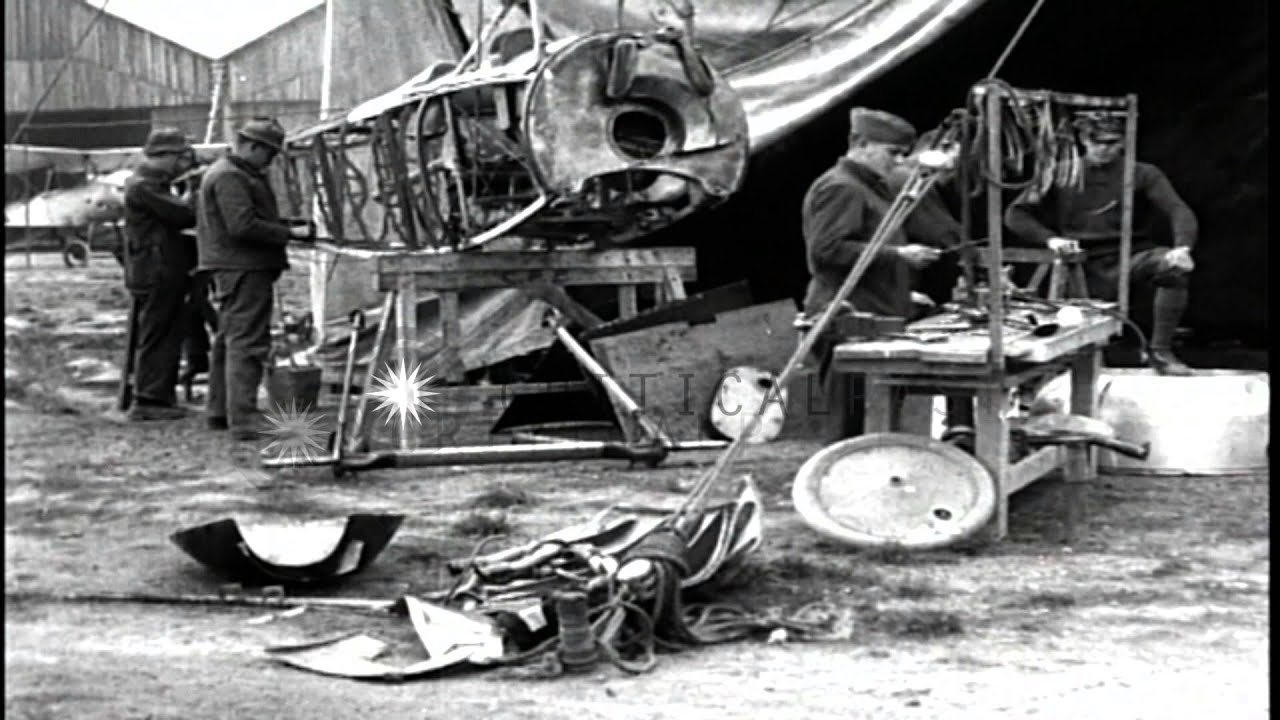Men repair the fuselage of a Nieuport biplane at the Second Aviation Instruction ...HD Stock Footage