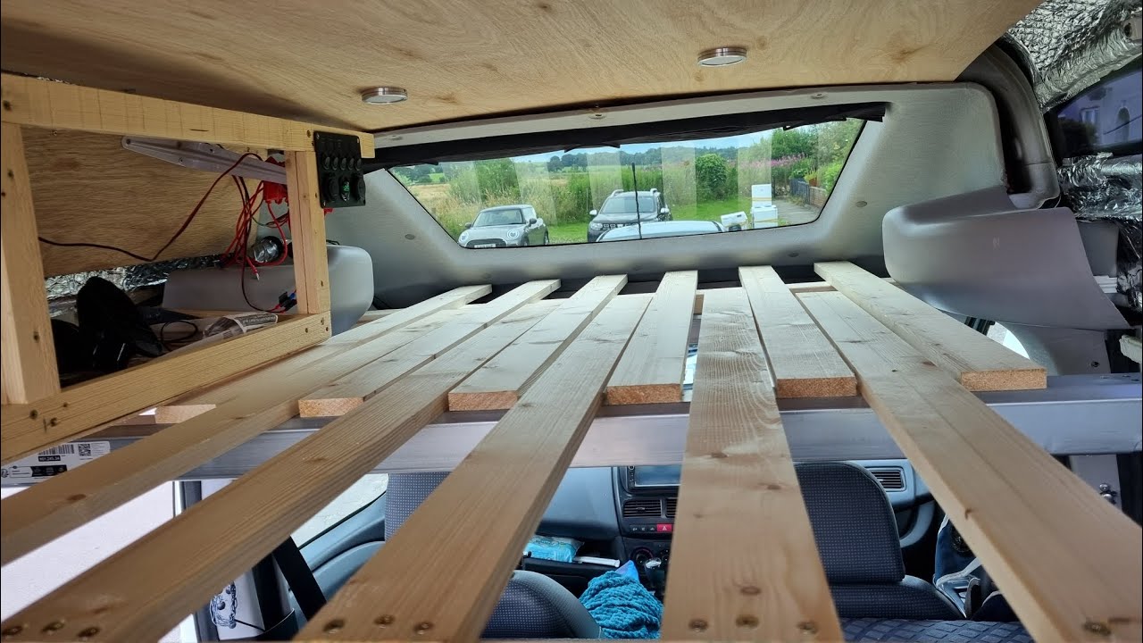 Thinking outside the box!  2 beds in a tiny Fiat Doblo Lily.  Floating Bed!  Over Cab Area.