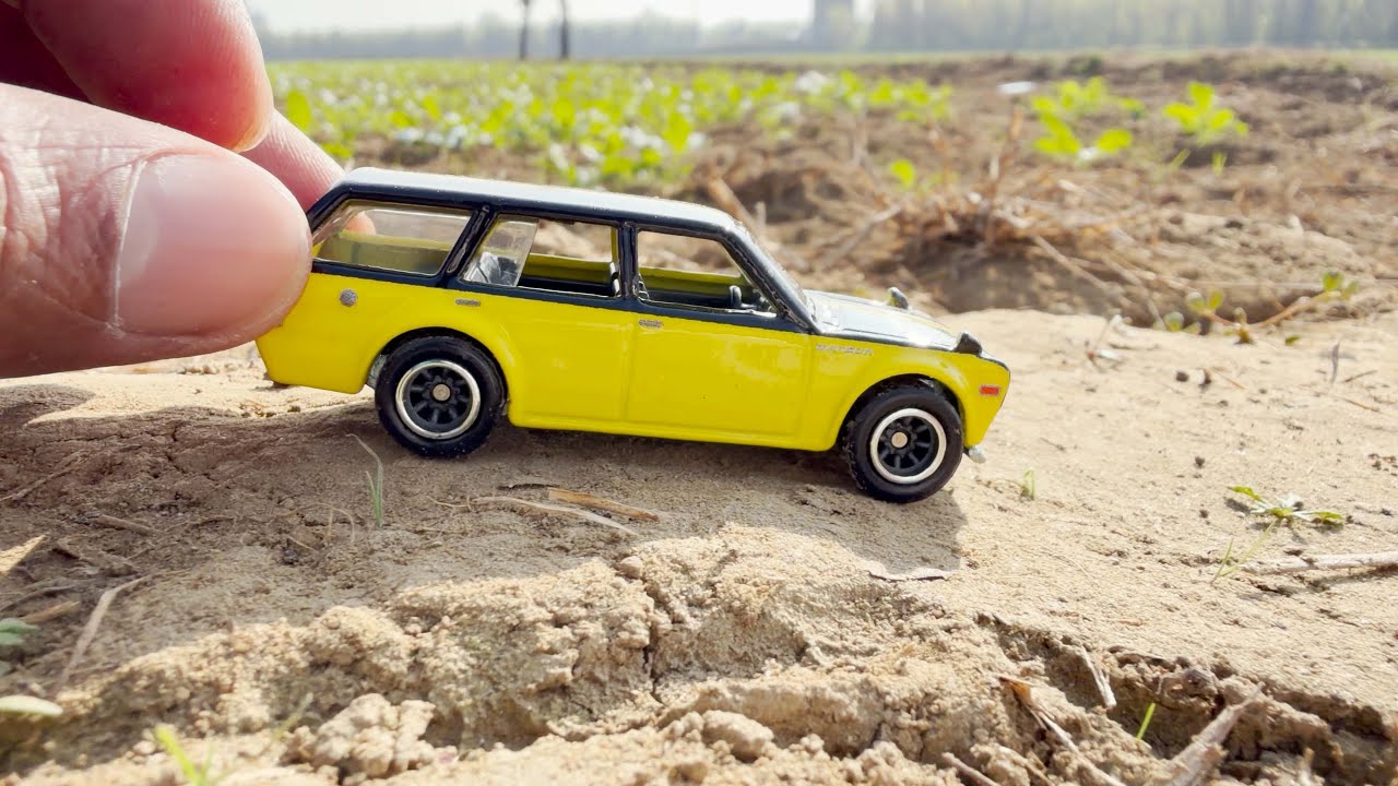 Yellow hot wheels car in the fields 