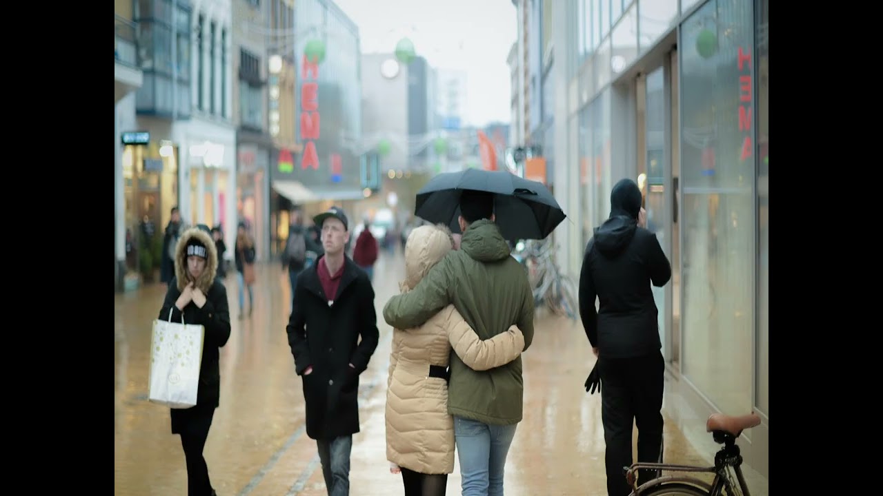 Enjoying Each Other's and Strangers Company Through the Rain