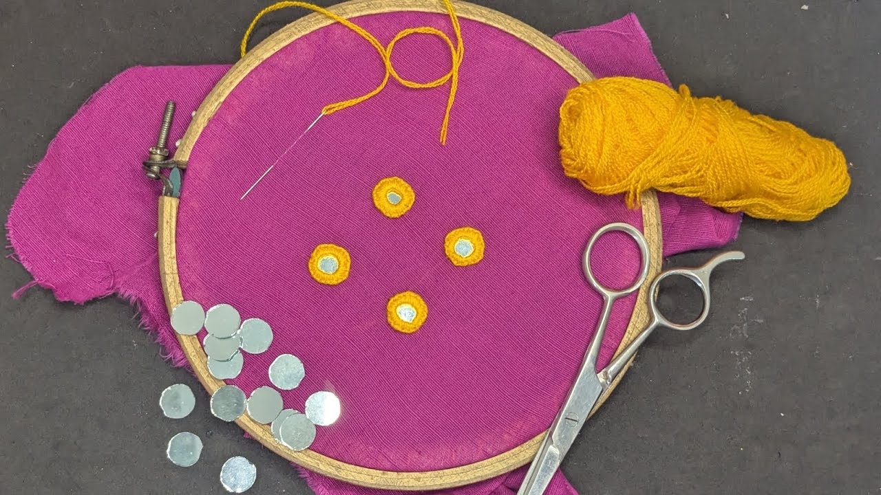 Round mirror embroidery in floral style on cloth 