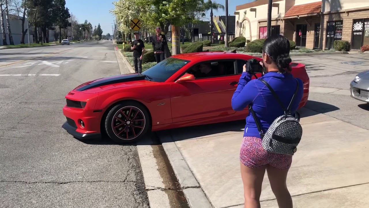 Accelerated racing Camaro show burn out cars leaving