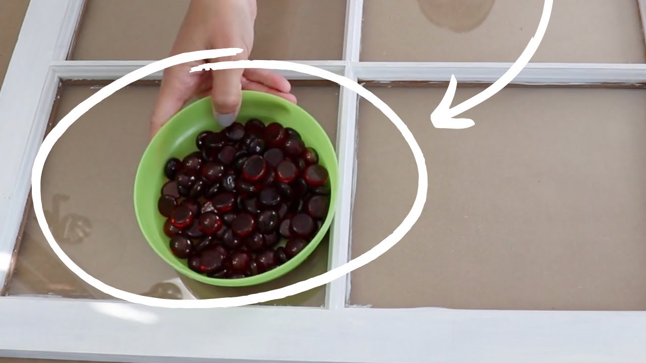 Place a bowl of red Dollar Store gems on an old window... (WOW!)