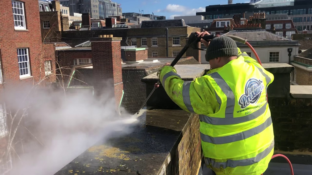 Doff steam cleaning Portland stone in the city of London