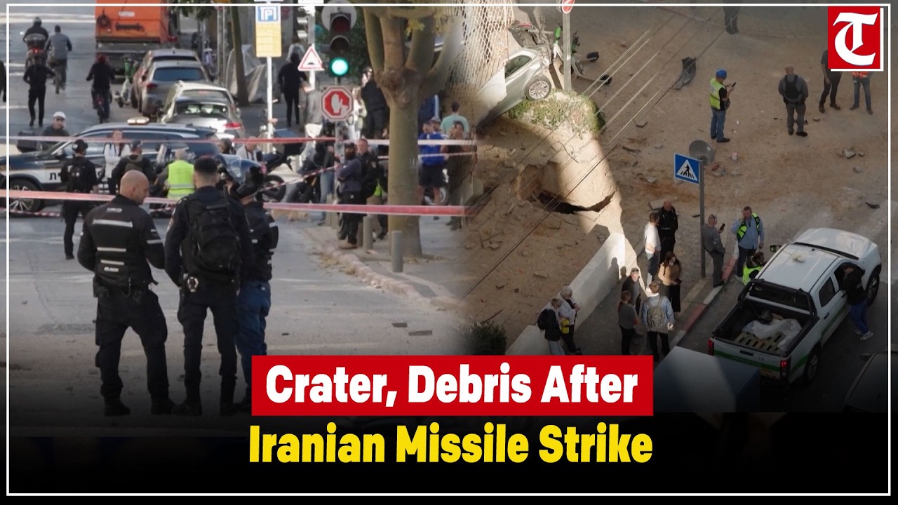 Watch the crater and destruction after Iranian missile hits central Israel amid escalating conflict