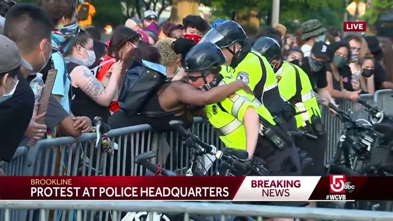 Protesters, police embrace after Brookline march, rally