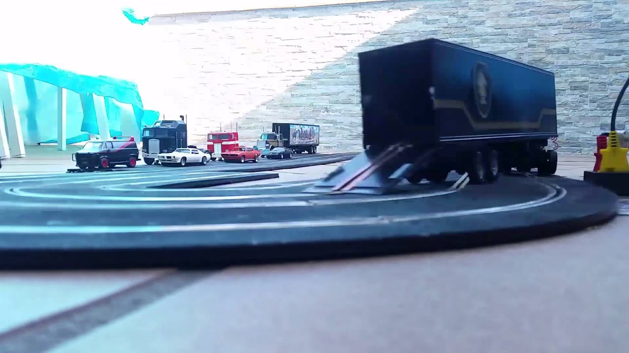 Slot. Knight Rider KITT up to the trailer.