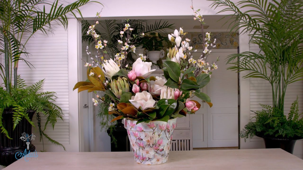 Mixed magnolia, blossom & winter white protea floral design