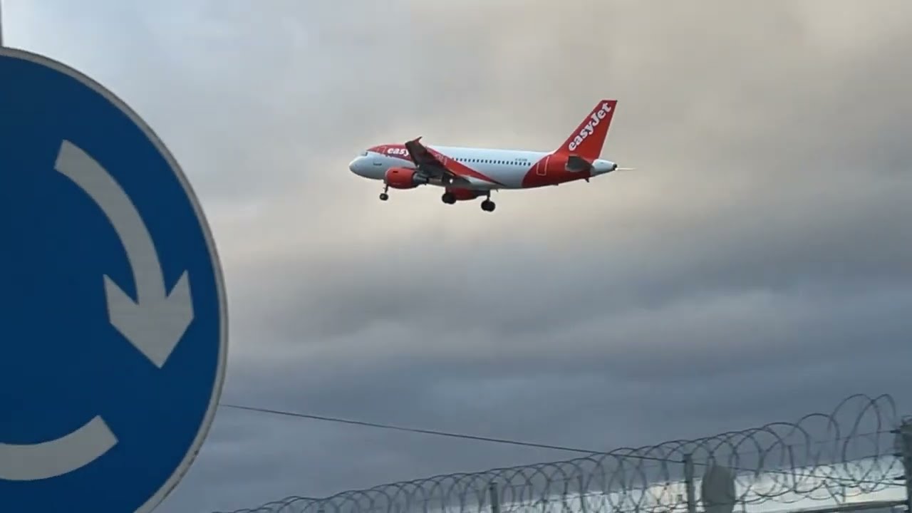 Easy A319 go around at EGKK rw 26L windy day