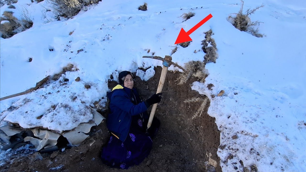 Winter storms force nomadic mother to build underground shelter