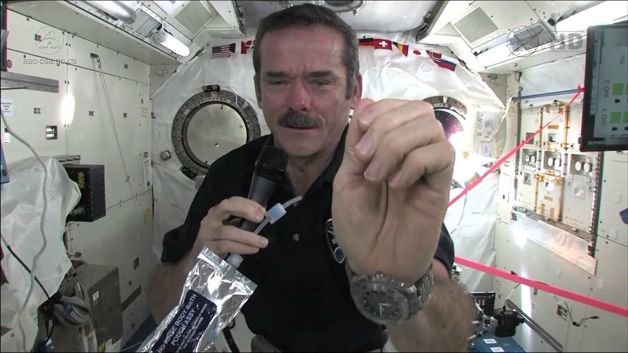 Chris Hadfield demonstrates how astronauts wash their hands in zero-g