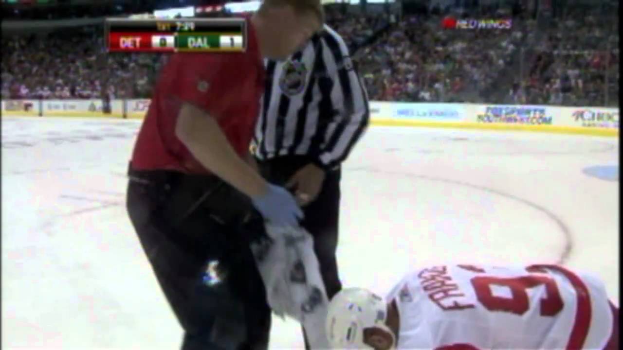 Johan Franzen gets elbowed by Mark Fistric
