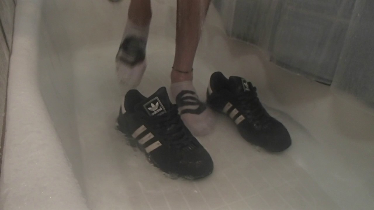 Shower in Black Adidas Superstars