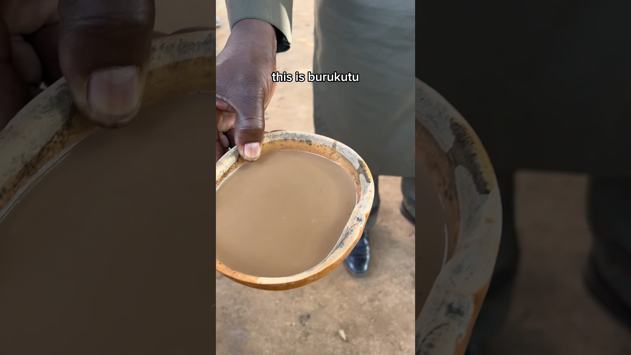 Trying traditional Nigerian alcohol in a village
