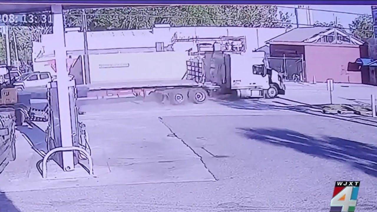 Video shows tractor-trailer slamming into Jacksonville building; driver in serious condition