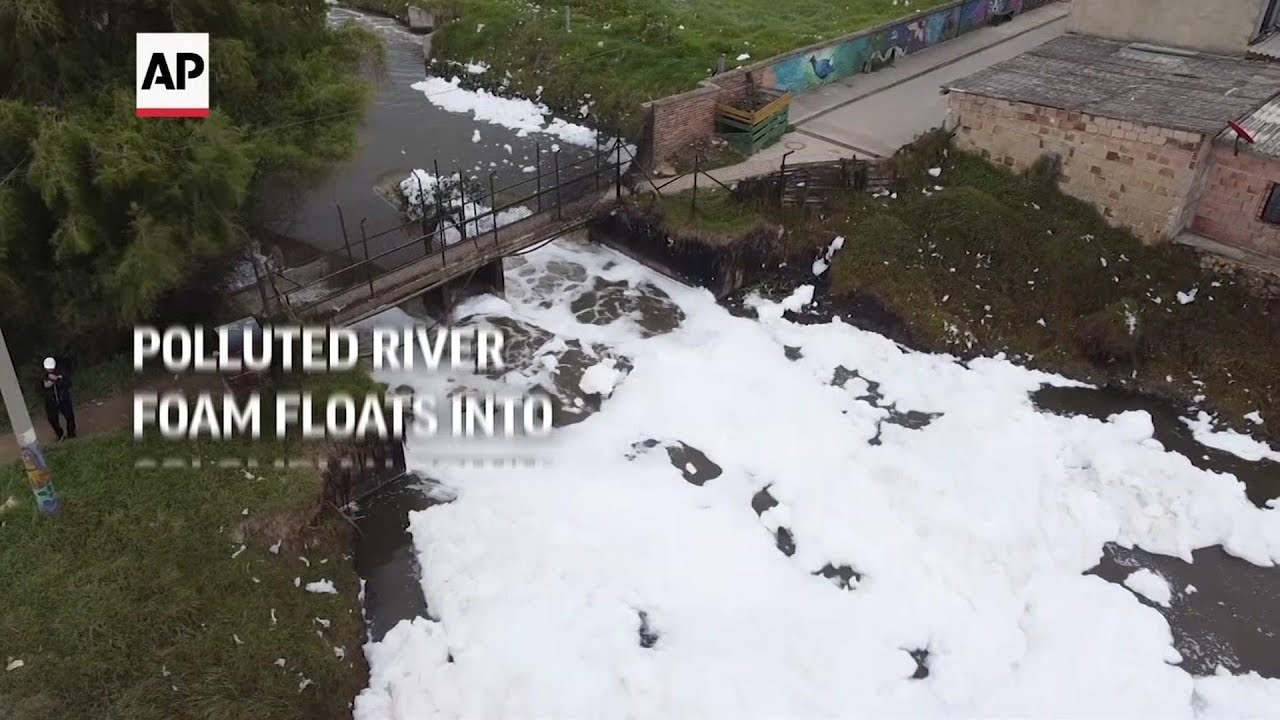 Polluted river foam floats into Colombian town