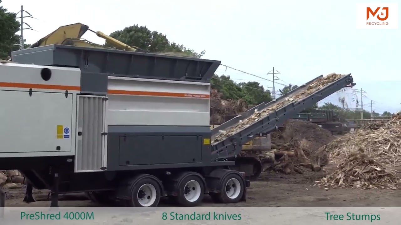 Shredding tree stumps – wood waste – M&J 4000S pre-shredder