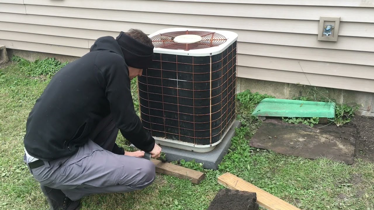 Leveling up an A/C condenser